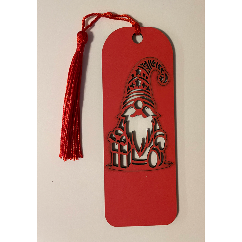 We have a double-sided bookmark with a wonderful gnome and his christman presents - one side is green and the other side is red.