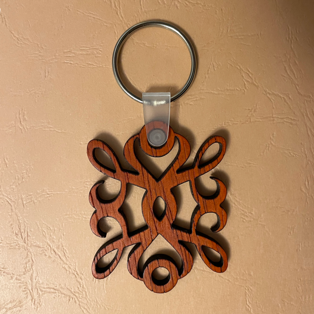 Keychain lasered out of the Exotic Padauk Hardwood.